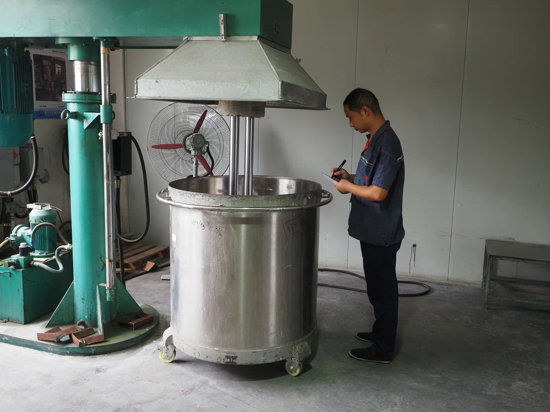 DSAN employee working at coating production equipment